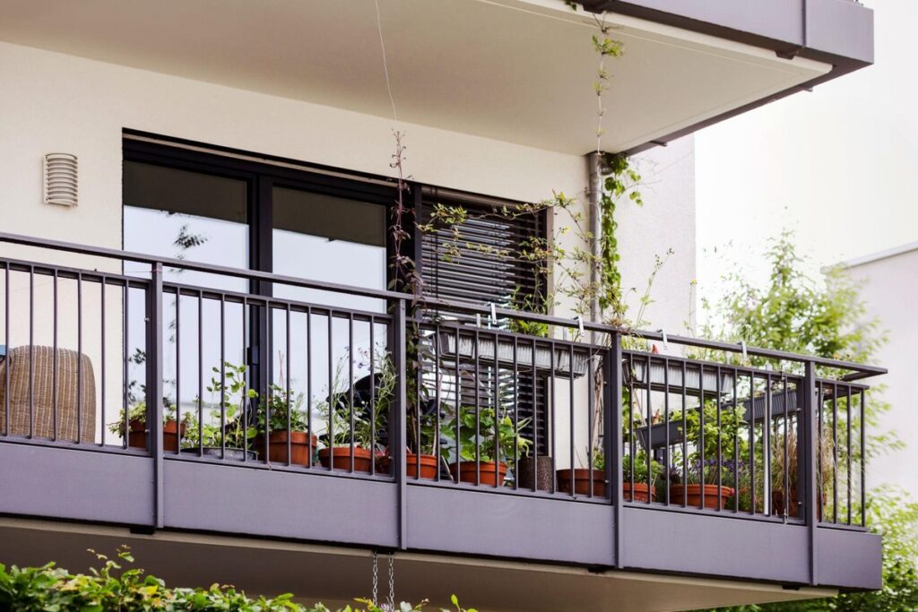Balcony gardening setup in urban apartment home
